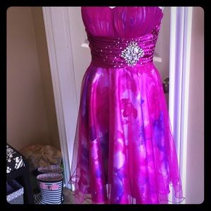 Fuchsia cocktail dress with floral underlay..